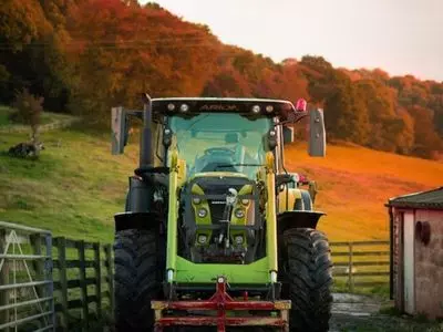 Tractor with trees behind it